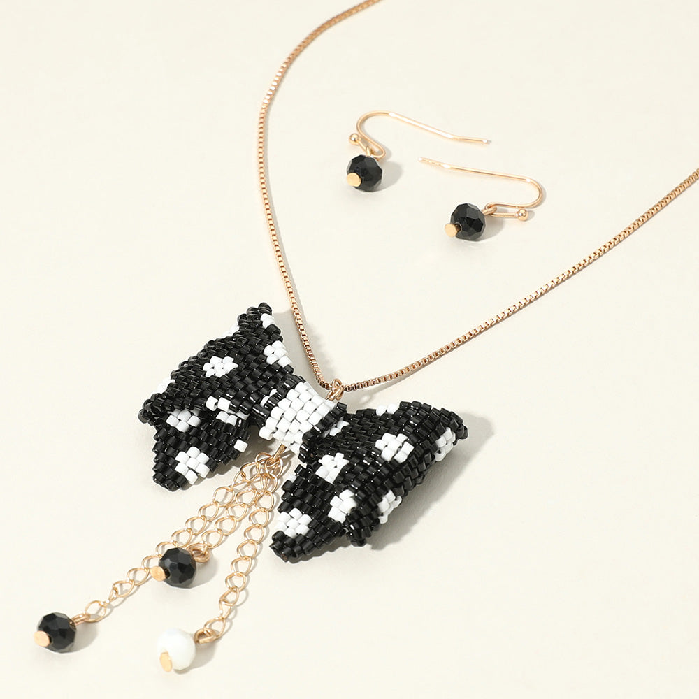 Black & White Beaded Bow Pendant Necklace
